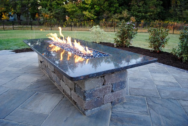 Outdoor stone table with fireplace