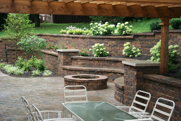Stone outdoor living space with fireplace
