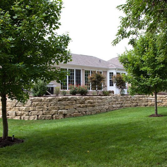 Backyard with natural stone wall