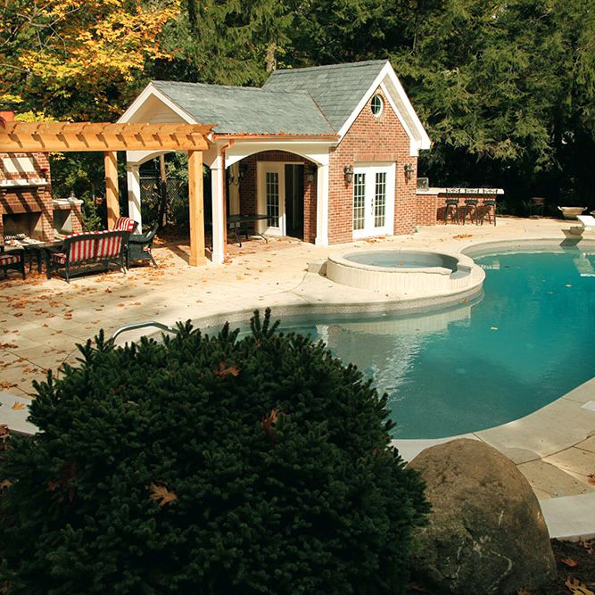 Luxuray pool patio with living space and pool house