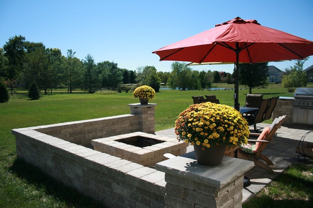 Stone patio with fireplace