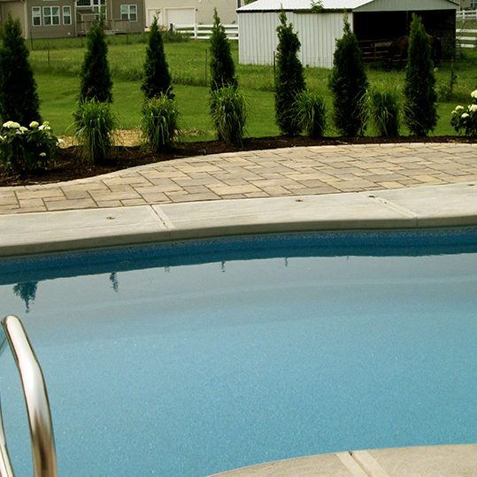 Outdoor pool with stone patio