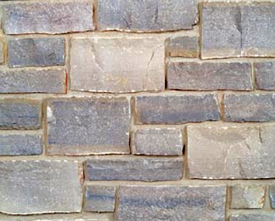 Charcoal cobble creek stone wall